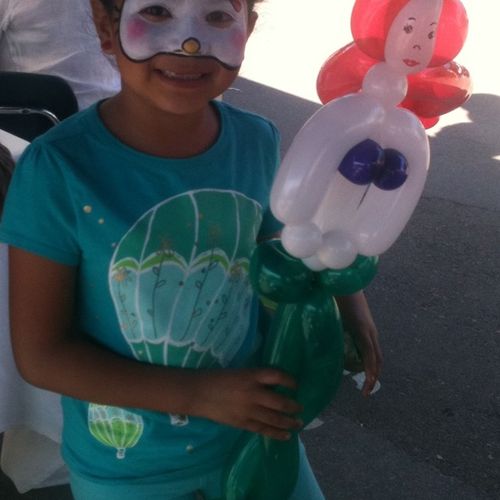 Face painting with balloon animals
