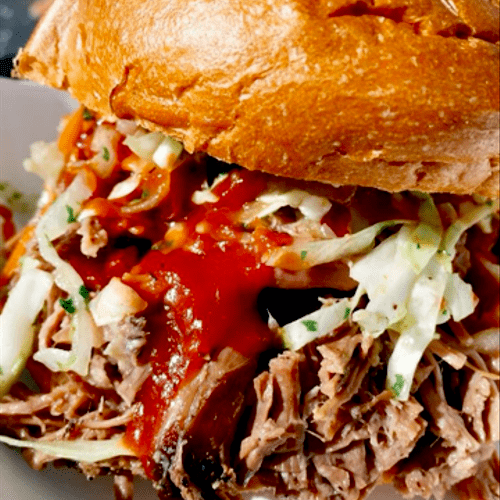 Brisket Sandwich topped with our House Slaw