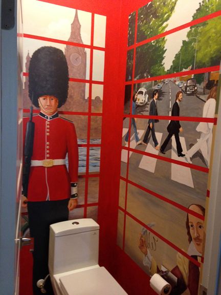Custom painting in powder room of British telephon