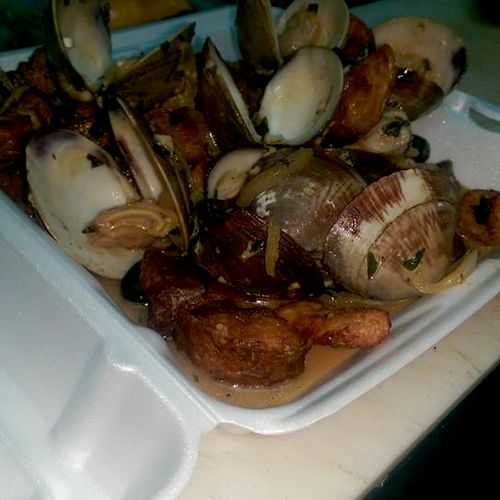 Portuguese style pork and clams in a white wine br