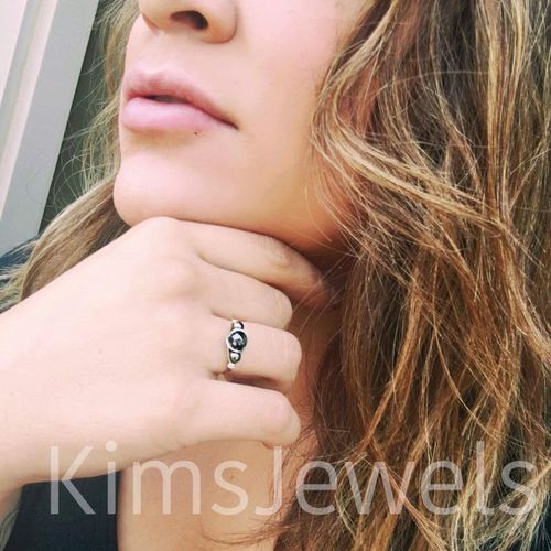 Model wearing a sterling silver gemstone bead ring