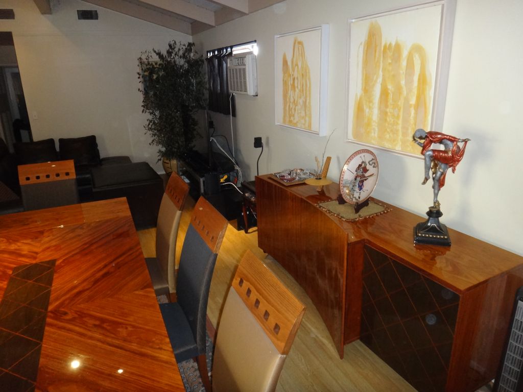 Living Room antiques, statues and art dusted and c