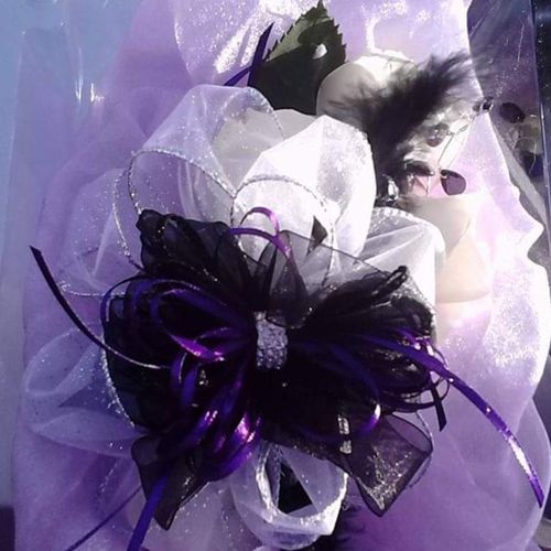 white rose corsage with black, dark purple and lav
