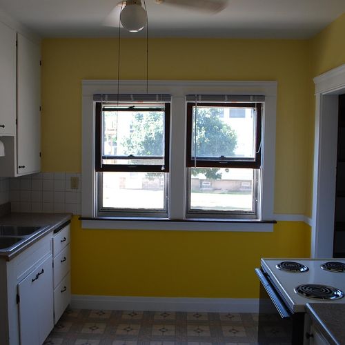 I painted the kitchen. Notice two shades of yellow