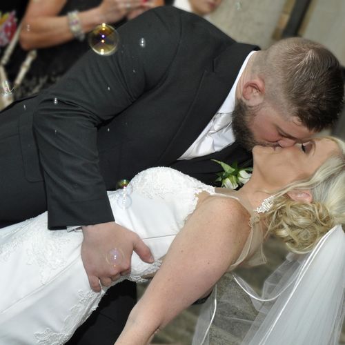 Portrait of Bride and Groom Kissing after Ceremony