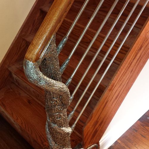 Highly custom tree sculpture for interior handrail
