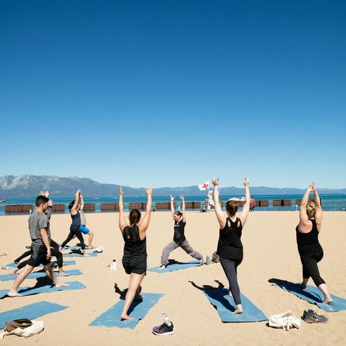 Private group yoga class on the beach.