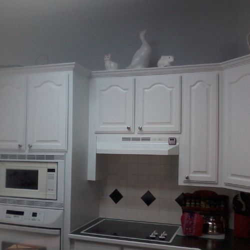 The cabinets were light brown. Sanded, primed and 