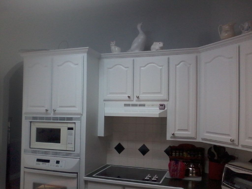 The cabinets were light brown. Sanded, primed and 