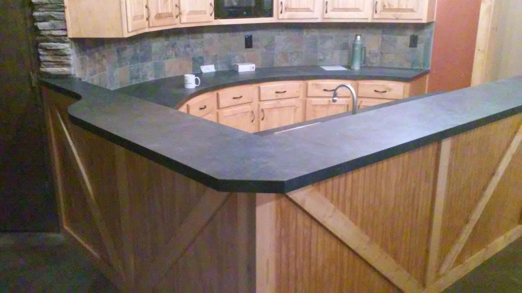 custom cabinets on radius wall with slate backspla