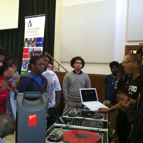 DJ 300 speaking to youth at a Communities In Schoo