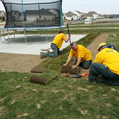 Grounds Guys of Toledo team members laying SOD for