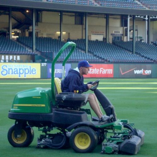Mowing the outfield while I was working for the Te