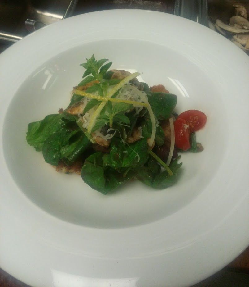 Herb encrusted chicken with a warm balsamic dressi