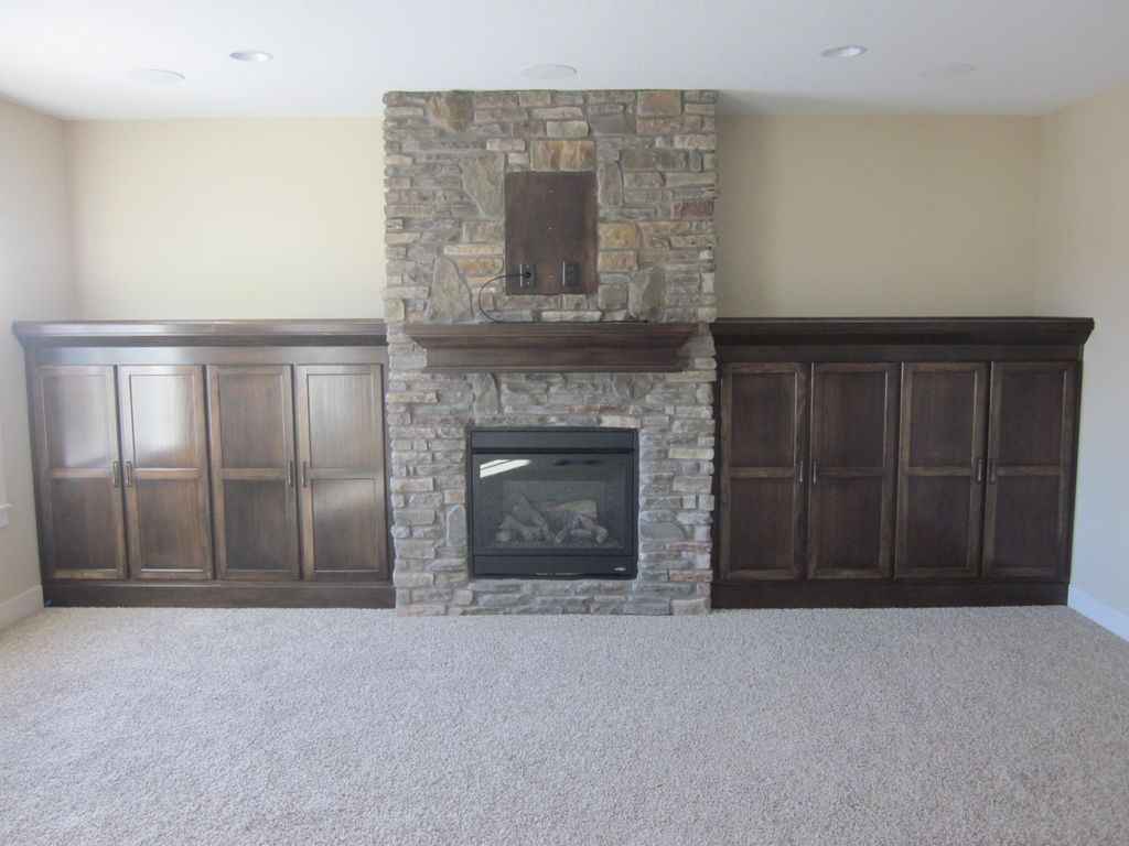 Custom built-in cabinets with matching mantel.