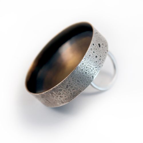 Large silver and brass cocktail ring.