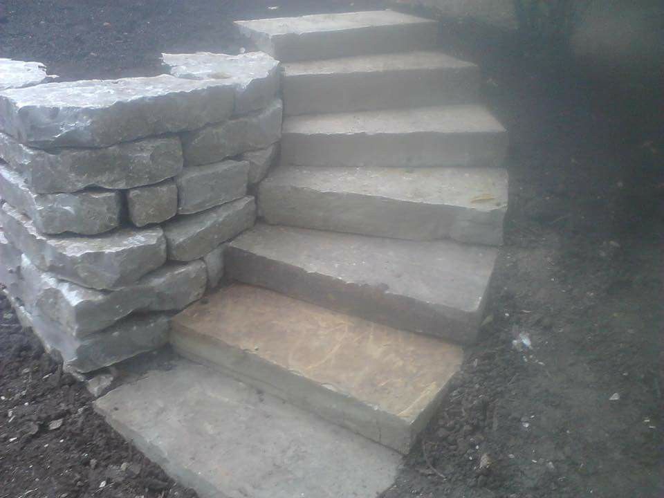Retaining wall and flagstone stairs.