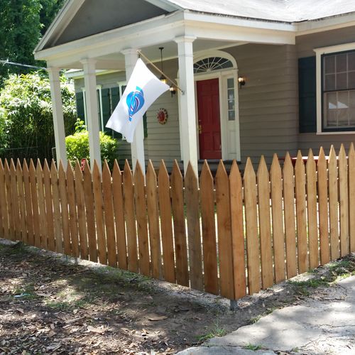 Cedar picket fence on Moss Street also painted the