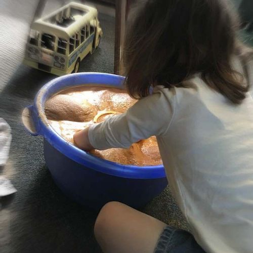  This child has flooded sand with water and sunk h