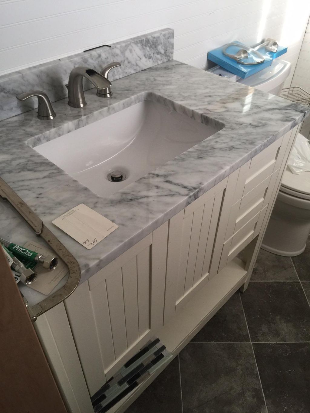 Freestanding vanity, granite countertop and sink. 