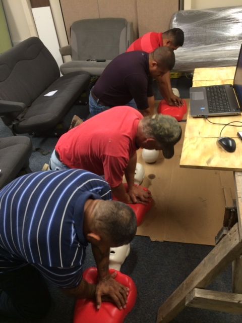 Teaching Adult CPR to workers at a sprinkler compa