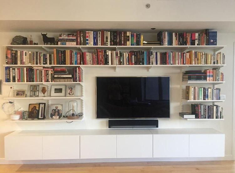 Living room media center with shelving and cabinet