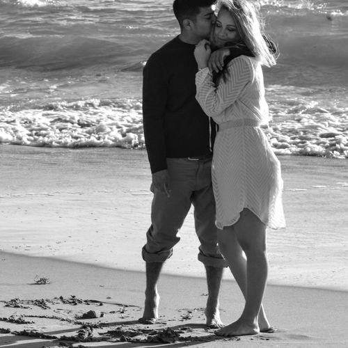 Engagement portrait on the beach printed in black 