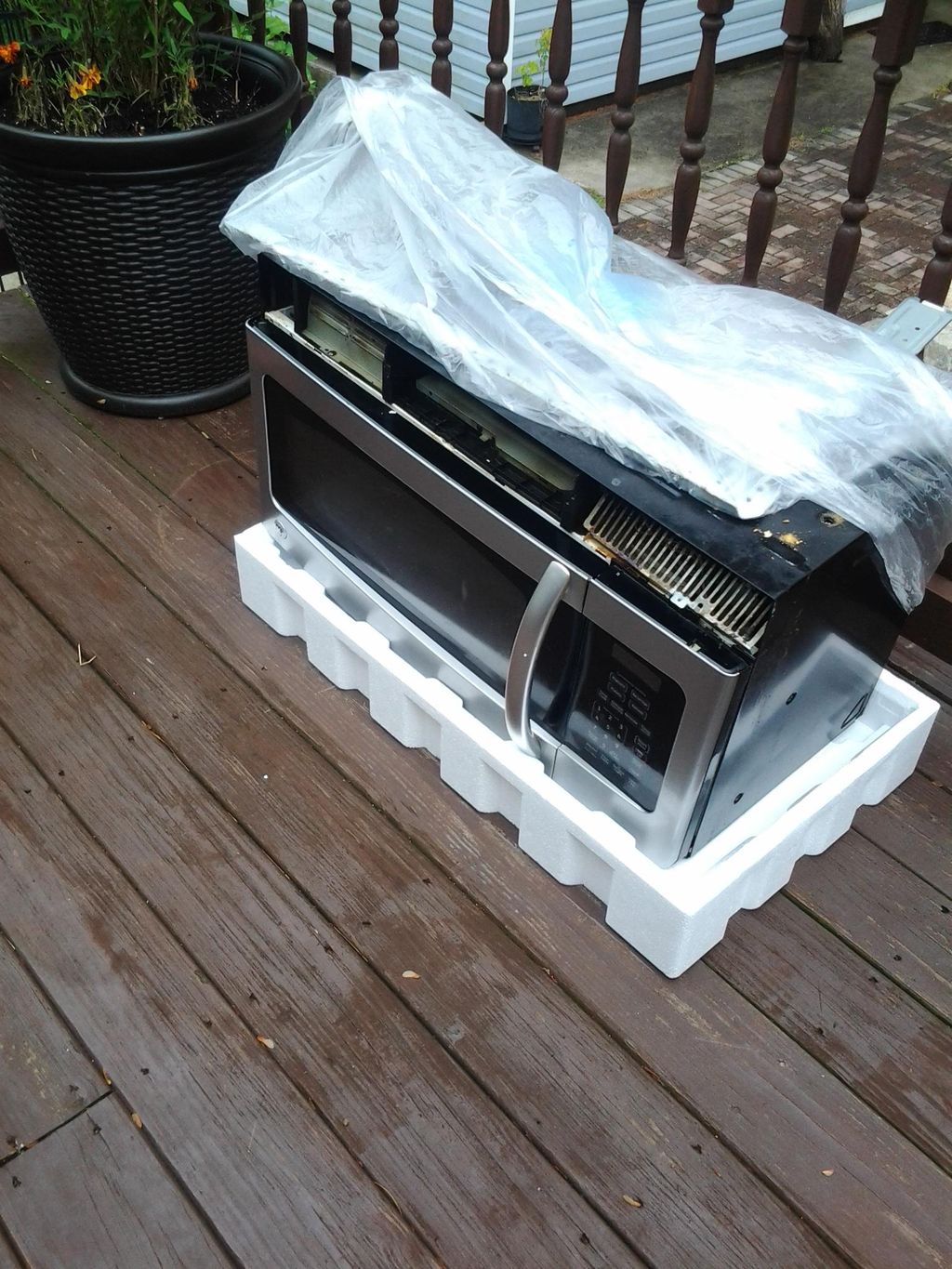 Removing old in-wall microwave oven.