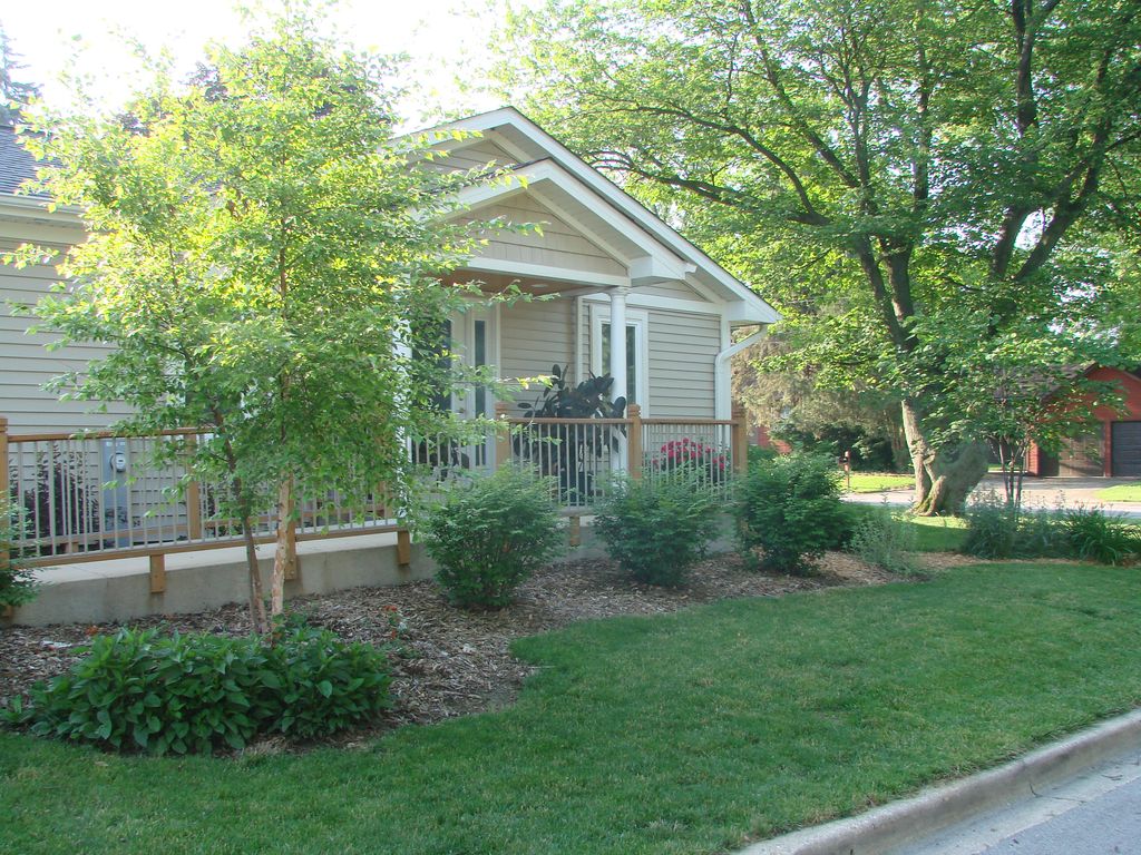 finished view of sidewalk ramp and landscaping of 