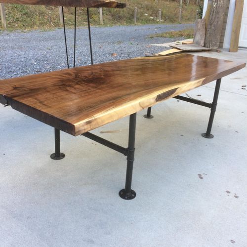 Walnut slab table with industrial legs