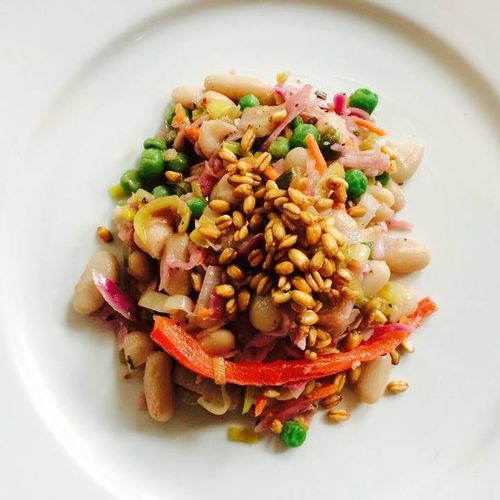 Warm bean salad with sweet peas, cabbage and leeks