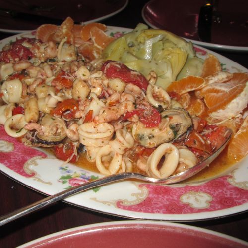 Seafood Salad with Tomatoes Clementines and artich