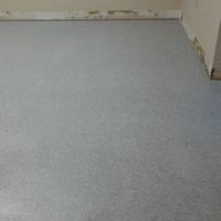 Out with the dirty carpet, new vinyl tile installe