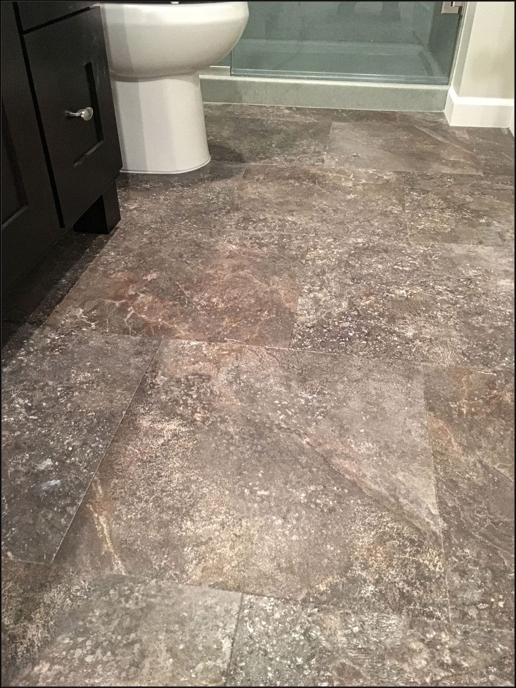Bathroom floor installation in Adura luxury vinyl 