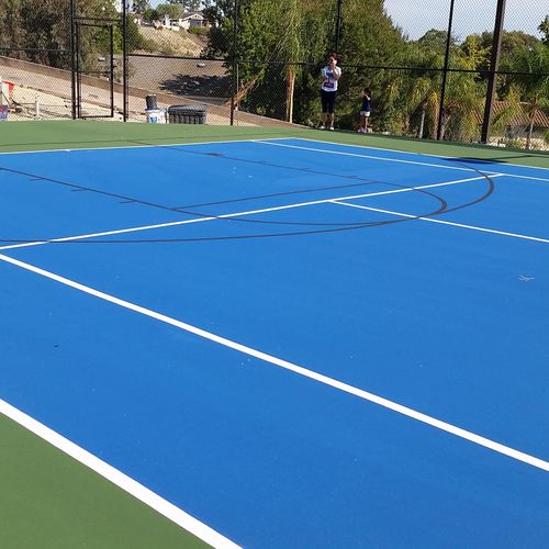 Custom tennis court resurfacing and installation.