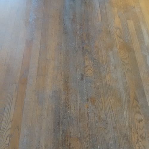 Heavily damaged hardwood flooring