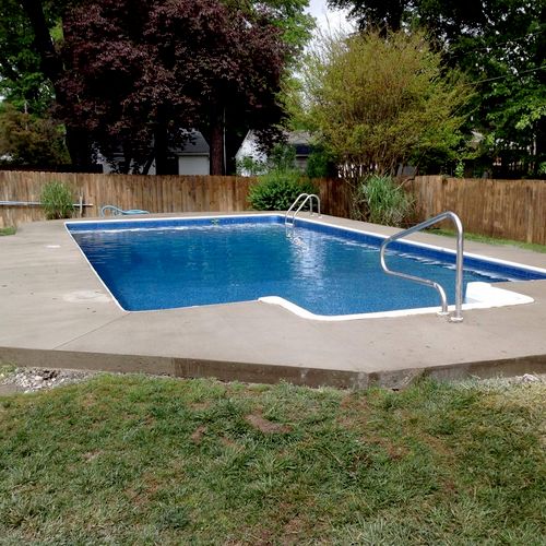 Concrete pool sidewalk surround.
