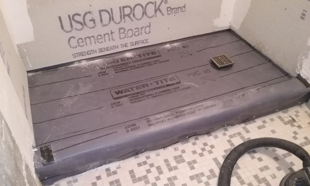 Note the proper shower pan installation - pre-slop