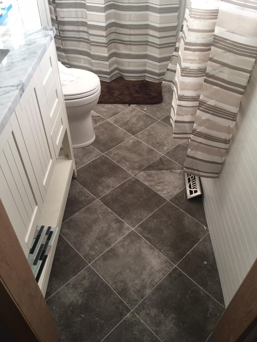 45° angle on a straight lay. Porcelain 12x12.