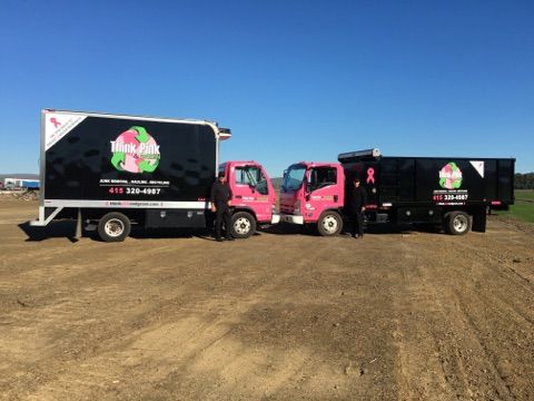 Our 14' box truck (left) and the 16' dump truck (r