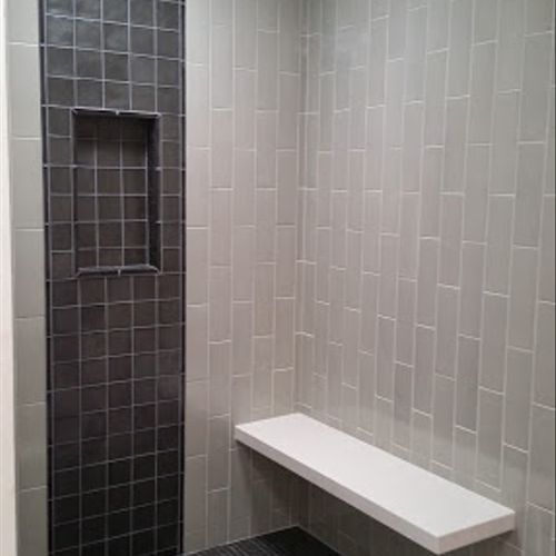 shower with green clay tile,and glass tile in the 
