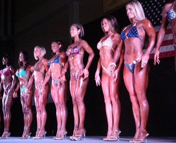 Posing on stage with my competitors