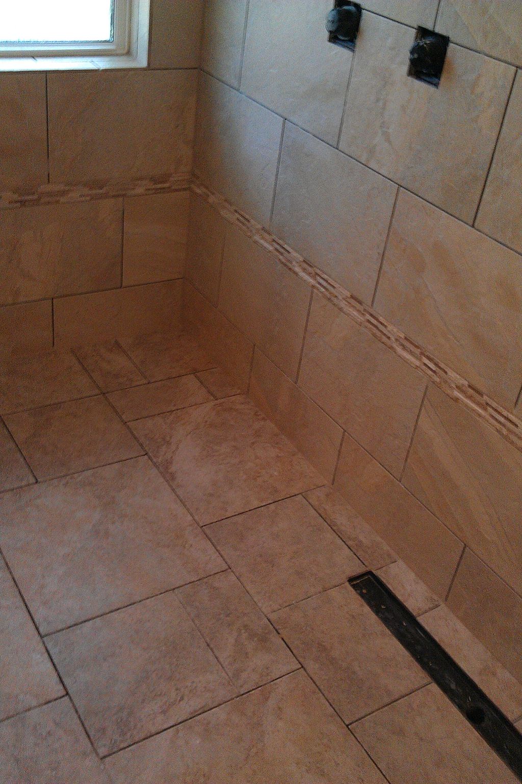 a curbless shower with line drain.