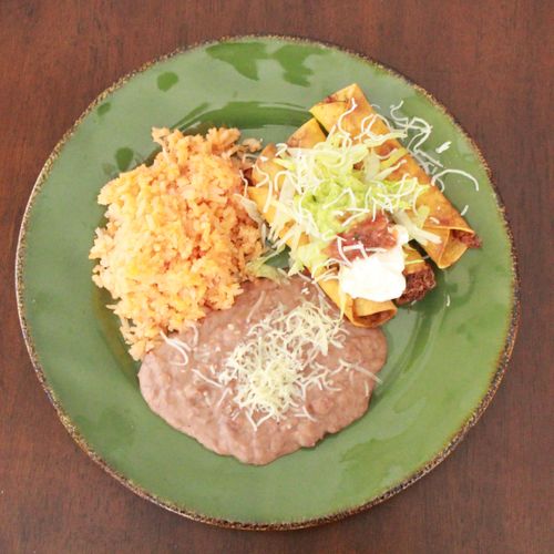 Marinated Shredded Beef  Taquitos with rice and be
