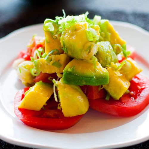 A refreshing tomato and avocado tossed salad
