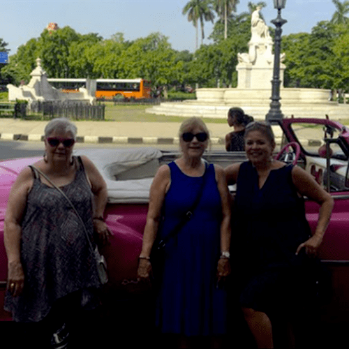 Clients in Cuba, Revolution Square, with a classic