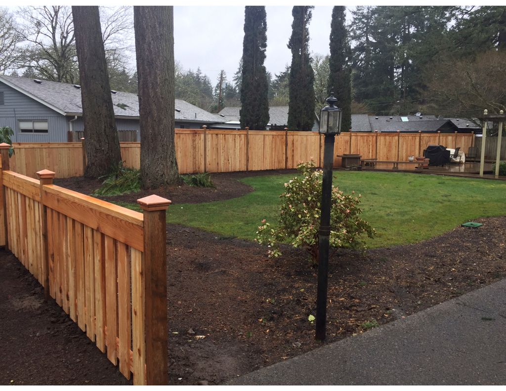 AFTER WOOD FENCE INSTALLED