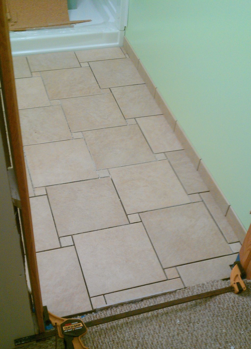 DURING New Bathroom Ceramic Floor Tile Installatio