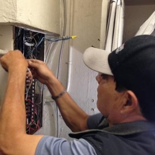 Juan Limon (Owner) installing a new electrical pan