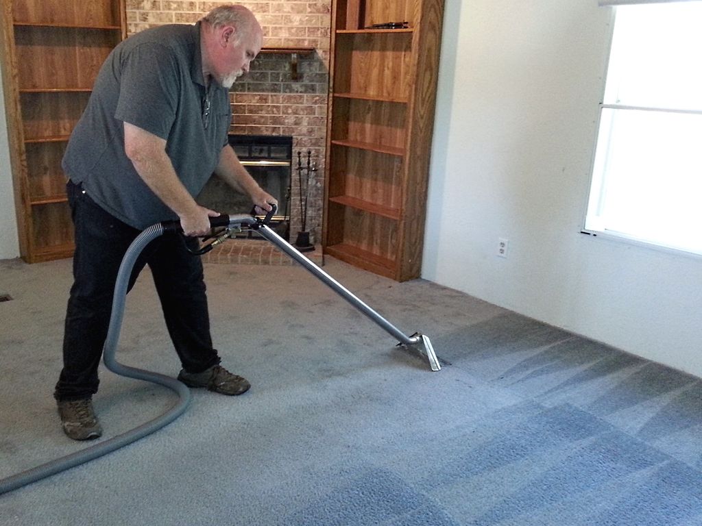 Carpet cleaning in progress.